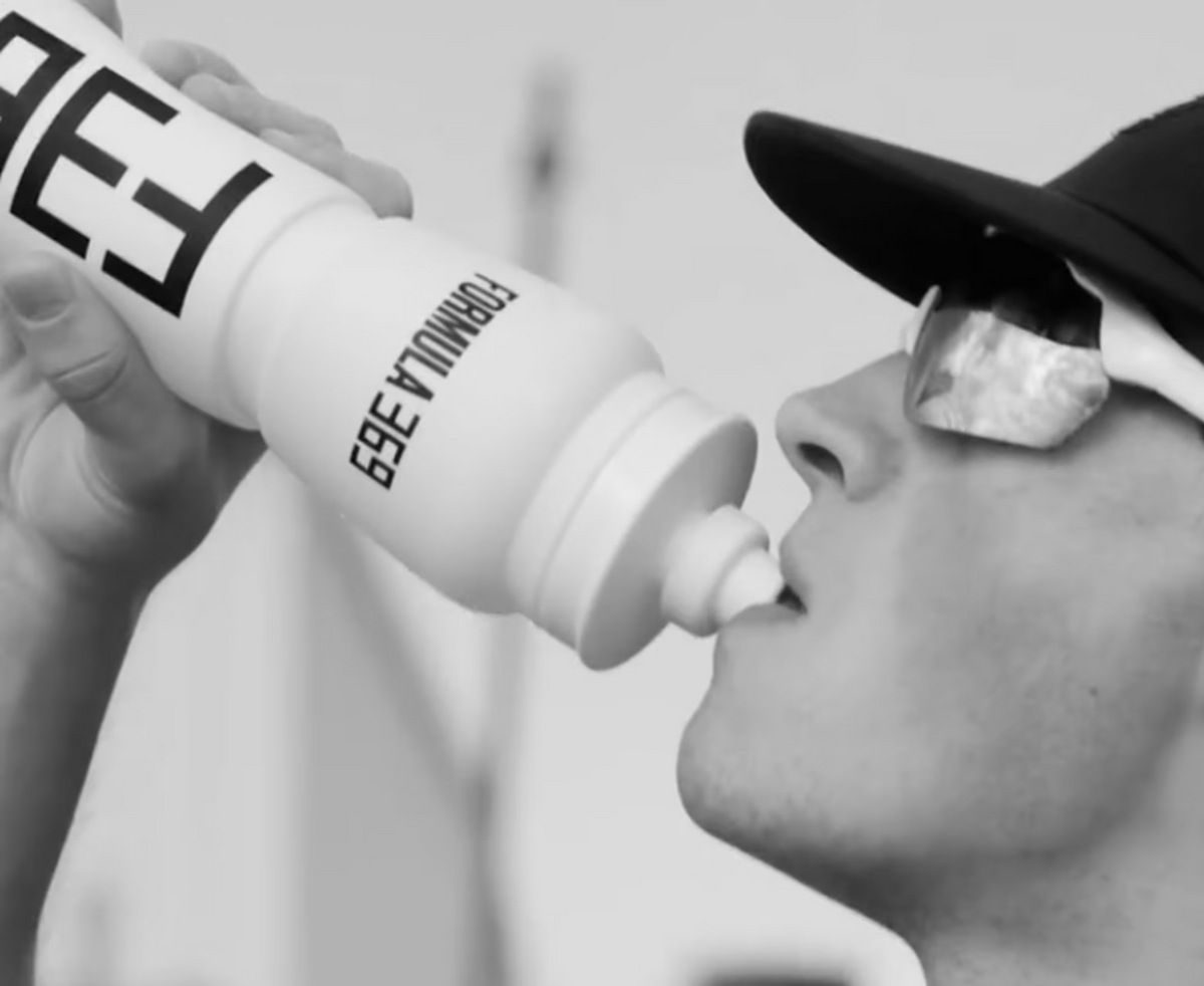 Athlete drinking Formula 369 from a soft flask